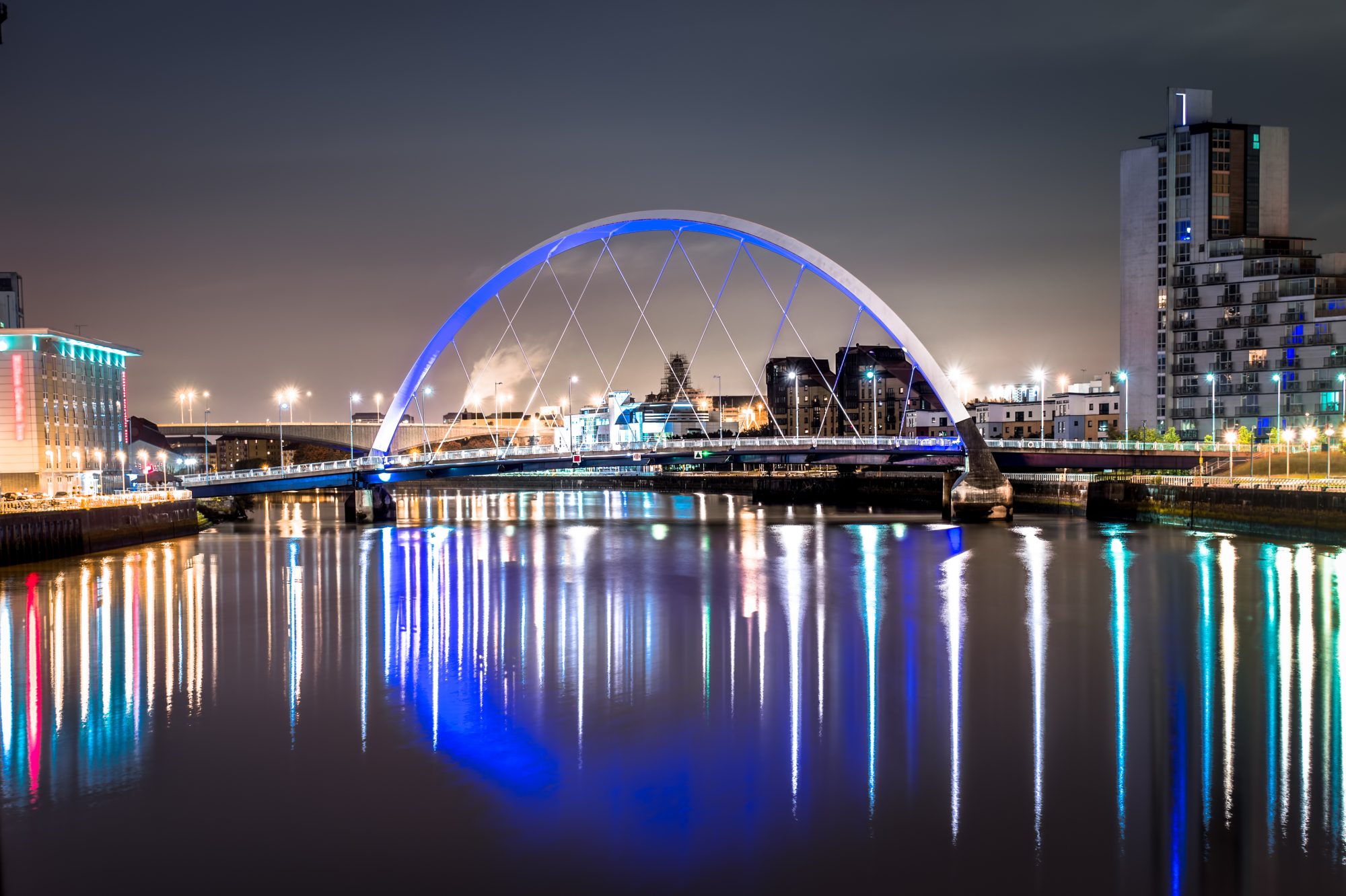 Nighttime shot of the Clyde Arc bridge in Glasgow, Scotland